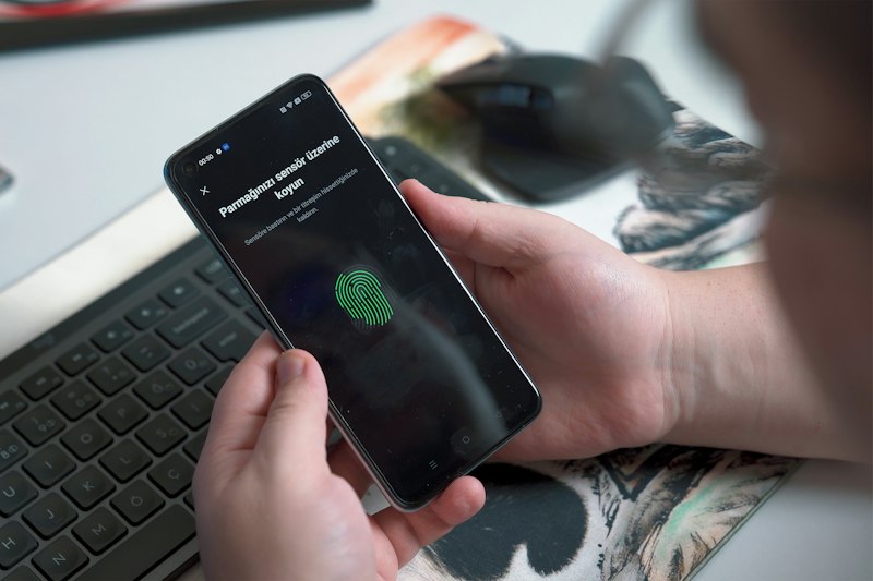 Staff member approving a secure sign-in with a fingerprint